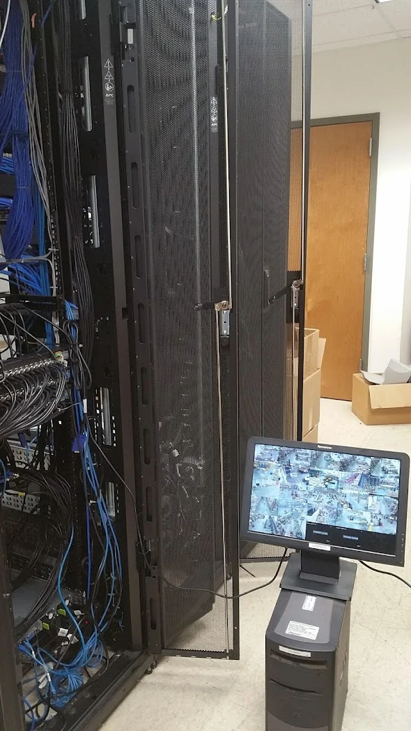 Existing communications cabinet with a connected service laptop