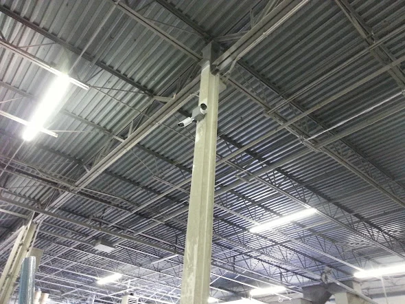 High-level building services and cable routes in a warehouse