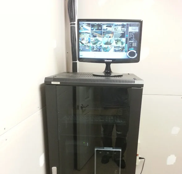 Video monitor above installed recording and network equipment