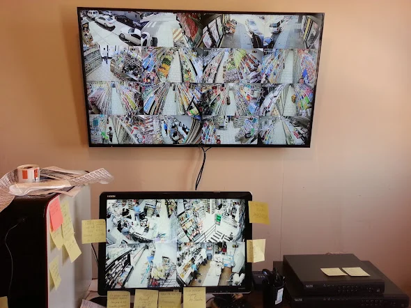 Two video displays showing multiple commercial camera views